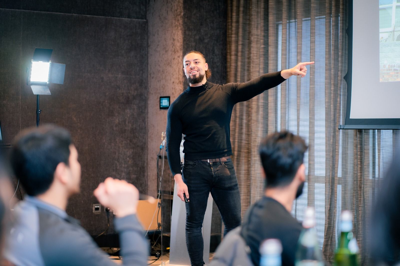 Liam Davies presenting to a room of business owners